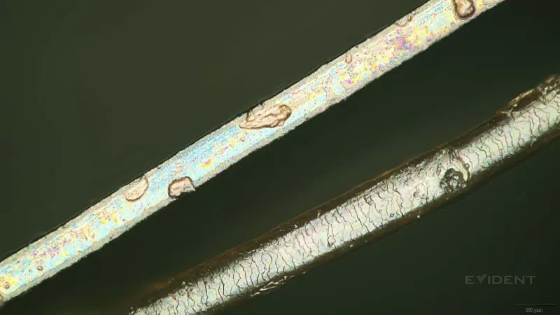 camera aperture blade next to human hair (left) and next to 2mm screw (right)